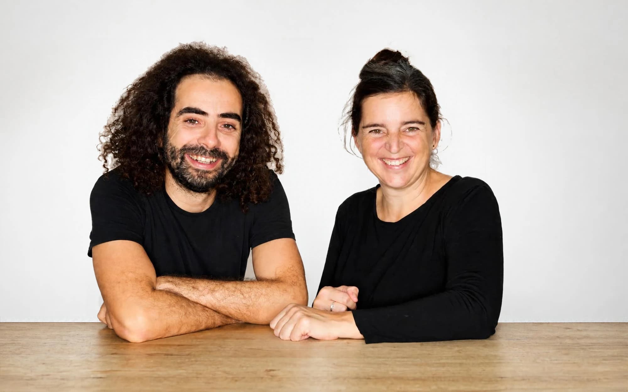 Mohamed Habbat and Flurina Giger at a table